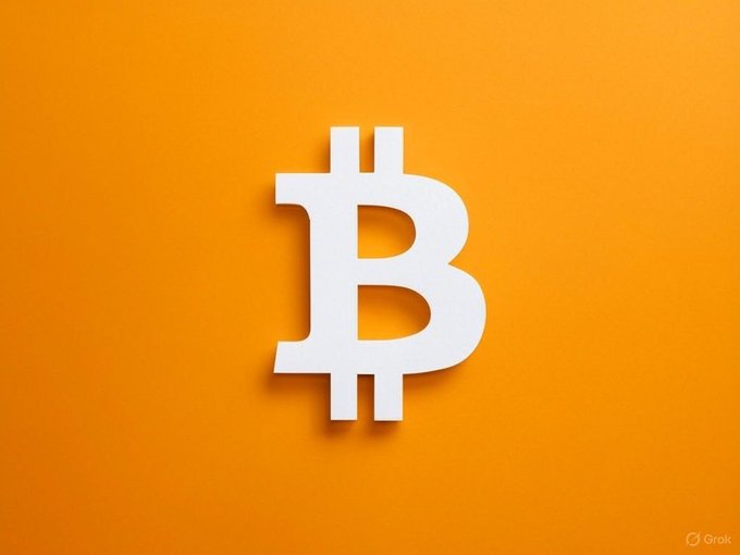 A white Bitcoin (₿) symbol is displayed prominently against a vibrant orange background. The image visually represents the post's announcement about researchers proposing "Shielded Bitcoin," a Zcash-inspired protocol for enabling private transfers on Bitcoin's Layer 1 without requiring consensus changes.