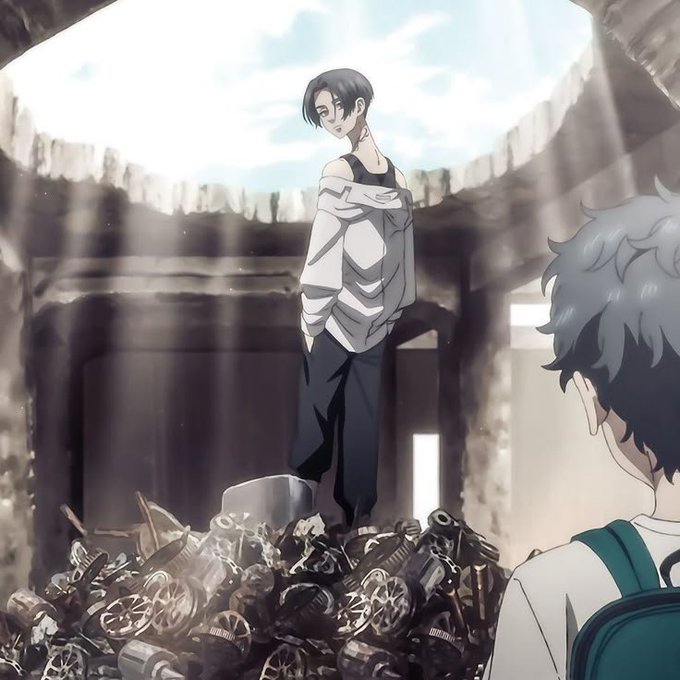 An anime-style illustration of a dark-haired character in a white shirt and black pants standing atop a pile of mechanical debris inside a ruined structure, while another character watches from the foreground.