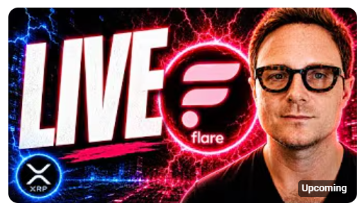 The image features a man wearing glasses and a black shirt, standing against a backdrop of red and blue neon lights. He appears to be smiling for the camera. Below him, there's text that reads "LIVE IN 5! (5 min, that is) @HugoPhilion with Chip and Jeff GO XRP on @FlareNetworks youtube.com/@OnTheChainLIV". The man in the image seems to be promoting a product or service related to cryptocurrency, as indicated by the text beneath him.