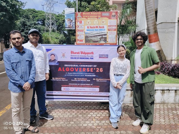 Group of four people posing in front of a banner for the inauguration ceremony of "ALGOVERSE'26" at Bharati Vidyapeeth College of Engineering, Pune.