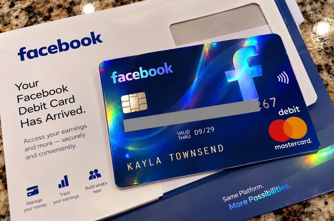 A Facebook Debit Mastercard issued by MetaBank, valid through 09/29, for Kayla Townsend sits on its accompanying 'Your Facebook Debit Card Has Arrived' packaging.