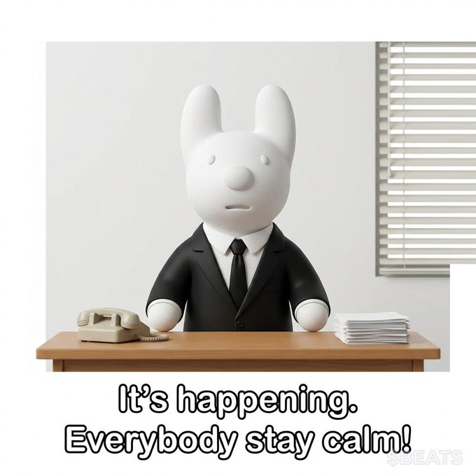 A 3D-rendered cartoon white bunny wearing a black business suit and tie sits at a wooden desk with a beige telephone and a stack of papers, accompanied by the caption "It's happening. Everybody stay calm!"