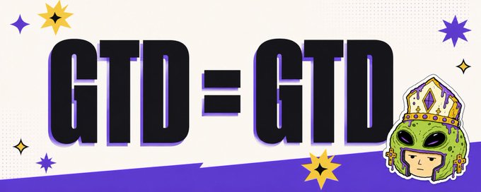 A graphic banner displaying the text 'GTD = GTD' in large bold letters, decorated with stars and featuring an alien character wearing a crown and cross earrings.