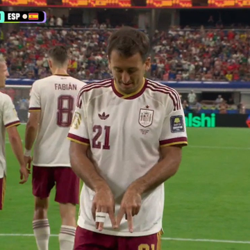Spain's Oyarzabal (#21), fresh off scoring the opening goal, celebrates on the pitch while teammate Fabián (#8) stands nearby as Spain takes a 1-0 lead, boosting their Polymarket win probability to 52%.