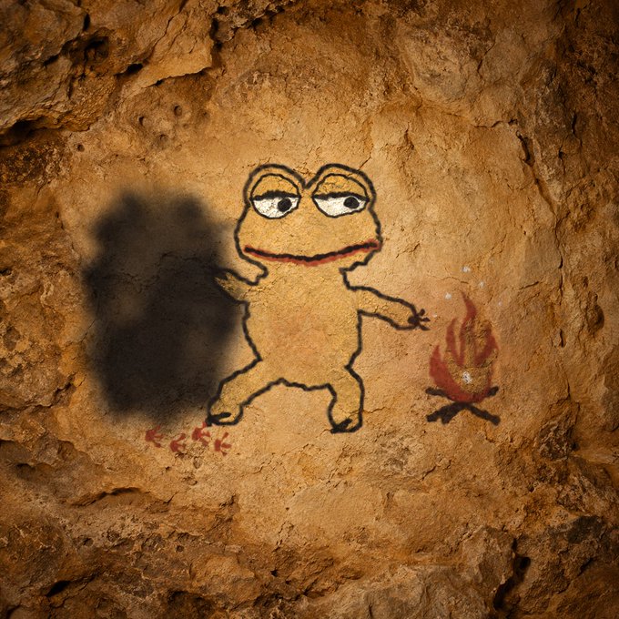 A cave painting-style illustration depicts a frog-like character standing near a campfire, casting a shadow on the rocky surface.
