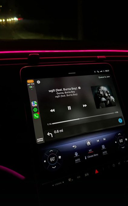 A nighttime car interior shot shows the infotainment screen playing "wgft (feat. Burna Boy)" by Gunna & Burna Boy at 03:37, with navigation indicating 0.6 miles to the next turn, fitting the post's "Goodnight" vibe as the driver winds down their evening.