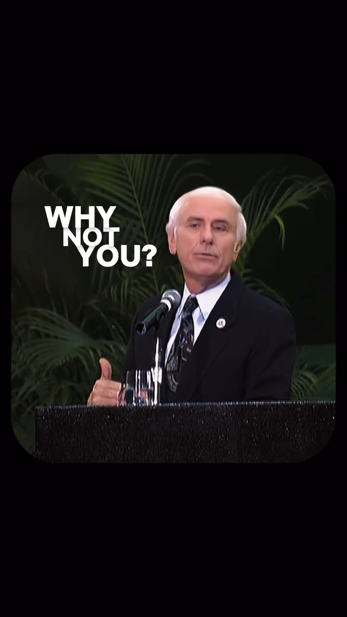 An older man in a suit and tie speaking at a podium, with the text 'WHY NOT YOU?' overlaid on the image.