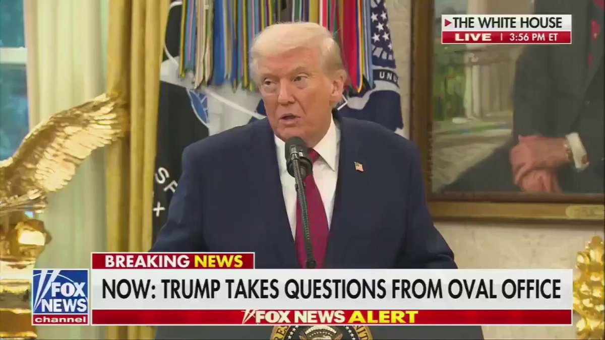A man in a suit delivers a speech at the White House, with a gold eagle statue and "BREAKING NEWS" banner above him.