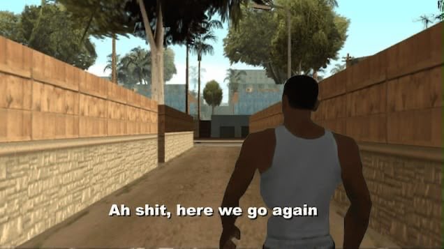 A video game screenshot showing a man in a white tank top walking down a dirt alley, with the subtitle 'Ah shit, here we go again' displayed at the bottom.