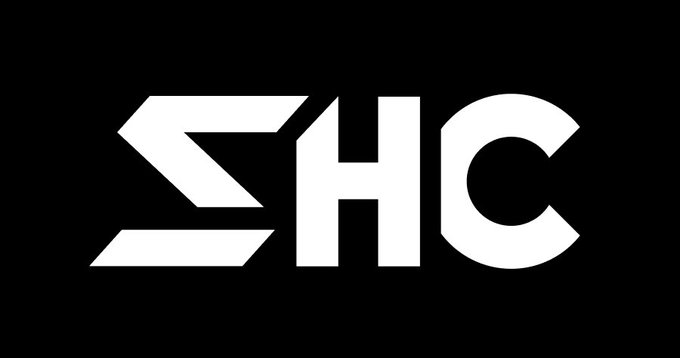 A minimalist logo featuring the stylized white letters "SHC" on a solid black background.