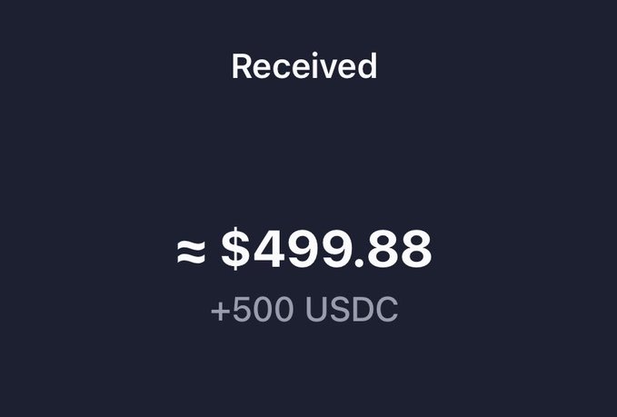 A digital transaction receipt showing a "Received" notification of approximately $499.88, with "+500 USDC" displayed below in gray text on a dark navy background. The image humorously illustrates the "magic internet money" comment by showing how a 500 USDC stablecoin transfer appears as roughly $499.88 in fiat value, highlighting the near but not exact conversion between the two.