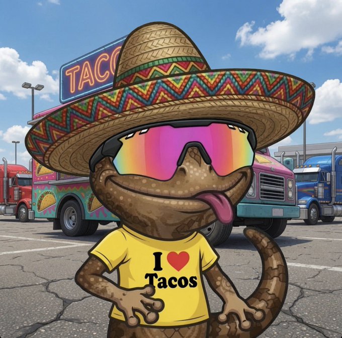 A cartoon illustration of a smiling gecko or lizard wearing a colorful sombrero, rainbow sunglasses, and a yellow "I [heart] Tacos" t-shirt, posed in front of taco trucks.