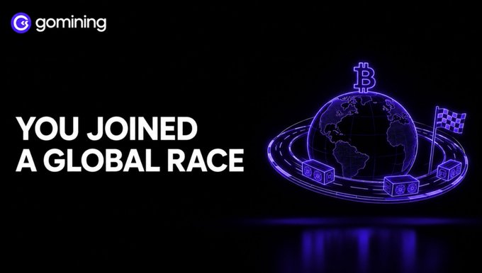 The image displays a GoMining promotional graphic with the text "YOU JOINED A GLOBAL RACE" in bold white lettering against a black background. Alongside the text is a neon purple/blue illustration of a globe topped with a Bitcoin symbol, surrounded by a racetrack with mining hardware and a checkered flag, visually reinforcing the post's message about Bitcoin mining being a continuous worldwide competition.