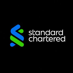 The Standard Chartered logo features a stylized blue and green S symbol next to the company name on a black background.