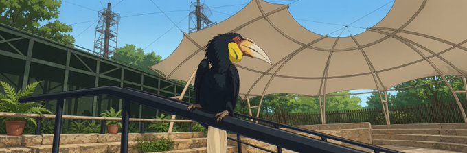 A hornbill bird perched on a railing under a white tensile canopy, with a communication tower visible in the background.