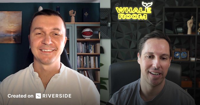 Two men appear in a split-screen video call recorded on Riverside, with a neon "WHALE ROOM" sign visible behind the man on the right. The image showcases the recently recorded interview between the host and cryptocurrency trader Kyle Doops from Crypto Banter for BeInCrypto.