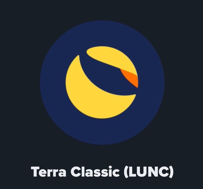 A dark navy logo featuring a stylized yellow and orange crescent or flame shape inside a circle, with the text 'Terra Classic (LUNC)' displayed below.