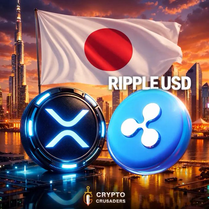 A Japanese flag waves above illuminated XRP and Ripple USD coin graphics against a Dubai skyline, with "RIPPLE USD" text displayed alongside a "CRYPTO CRUSADERS" logo at the bottom. The image visually reinforces the post's claim of RLUSD becoming Japan's first regulated foreign stablecoin, celebrating the milestone for XRP adoption in a major market.