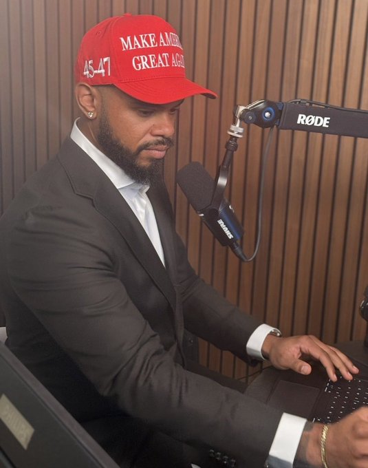 A man wearing a red "MAKE AMERICA GREAT AGAIN 45-47" hat sits at a podcast microphone in a wood-paneled studio, looking down at his laptop. The image pairs with a post expressing regret for supporting Trump and criticizing his presidency and alleged cryptocurrency dealings.