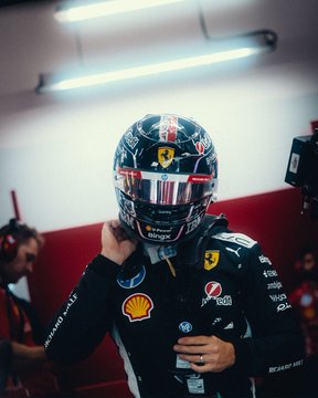 A Formula 1 driver suited up in Ferrari race gear, with his helmet featuring the Mission Winnow branding and Italian flag stripe down the center, prepares for the Singapore Sprint as text overlays identify him as "Charles Leclerc." The image's high-adrenaline pre-race atmosphere and precision detailing align with the post's reference to the rush of a "god candle on the charts."