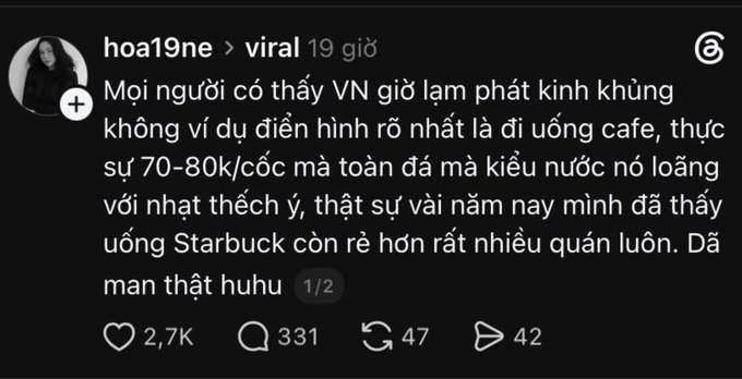 A screenshot of a Threads post by user 'hoa19ne' in the 'viral' feed from 19 hours ago, with Vietnamese content about coffee prices reaching 2.7K likes, 331 replies, 47 reposts, and 42 shares.