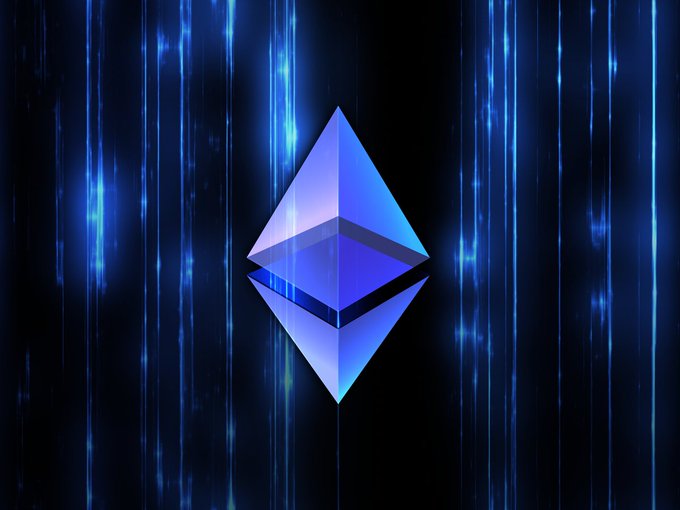 The Ethereum logo, a diamond-shaped geometric figure in blue and purple gradients, set against a dark background with vertical blue light streaks.
