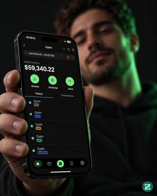 Close-up of a person holding a smartphone displaying a 'Zypto' crypto wallet app with a balance of $59,340.22, listing tokens including ZETA, THETA, BNB, SOL, and Arbitrum.