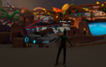 A low-resolution, blurry image of a character in a green outfit standing in what appears to be a video game environment with various objects and a blue glowing item.