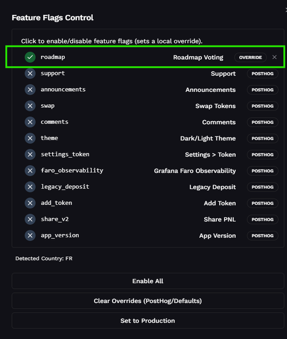 The image displays a "Feature Flags Control" panel where the "roadmap" flag (Roadmap Voting) is highlighted with a green outline, showing an "OVERRIDE" status with a green checkmark indicating it is enabled locally, while other features like "support," "swap," and "comments" are marked as "POSTHOG" and disabled. This visual guide directly corresponds to the post's instructions for v1 token holders to press ALT+D and activate the roadmap feature to view voting options for bringing their token to Odin.fun v2, illustrating exactly where users need to toggle the "roadmap" flag to reveal the voting interface on legacy odin.fun.