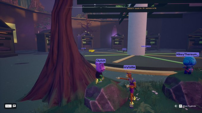 A video game scene showing animated characters with name tags 'Clutch', 'crybtolie', and 'MikeyThereum_' near a tree in a virtual environment with 'Round 2 - usual, no 10 - Bamoth In 8s' displayed.