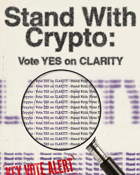 The image features a magnifying glass with the text "Vote Yes on clarity" written above it. The magnifying glass appears to be held over an envelope, which has the words "Stand With Cryptocurrency" written on it. The background of the image is white and purple, providing contrast for the text. The overall theme of the image seems to be related to a political campaign or message encouraging people to vote and support cryptocurrency initiatives.