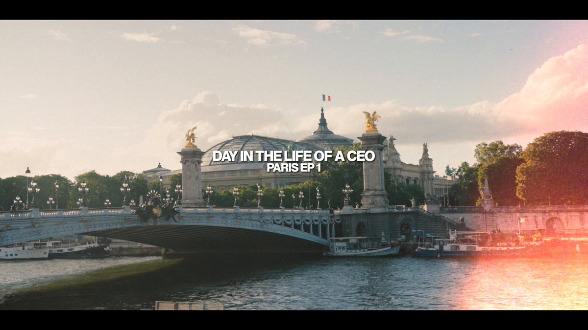The image shows a view of the Paris skyline from the Seine River, featuring the iconic Eiffel Tower. The text "Day in the life of a CEO" is displayed above the scene, suggesting that this photo was taken during a meeting or event related to business and leadership.