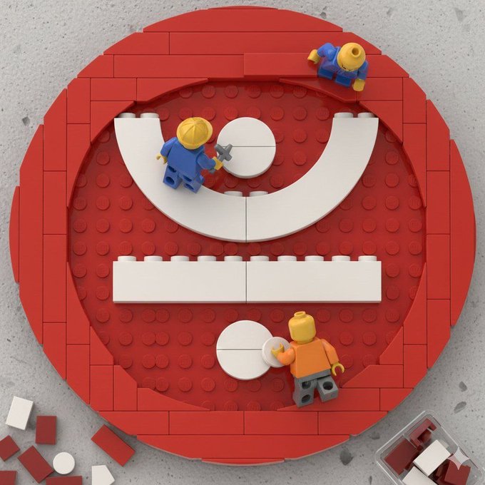 A creative 3D illustration of a red circle with a sad face built from Lego bricks, featuring two Lego minifigures working on the face.
