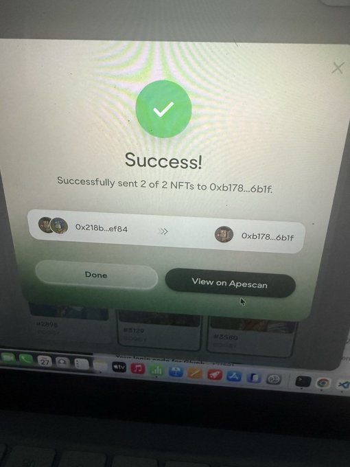 A laptop screen displays a success message confirming 2 NFTs were successfully sent to address 0xb178...6b1f, with options to 'Done' or 'View on Apescan'.