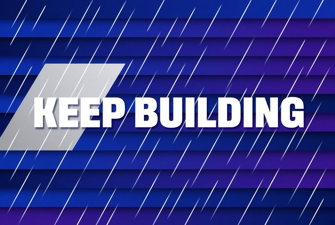 A bold graphic displays the text 'KEEP BUILDING' in large white letters against a blue and purple background with diagonal line patterns.