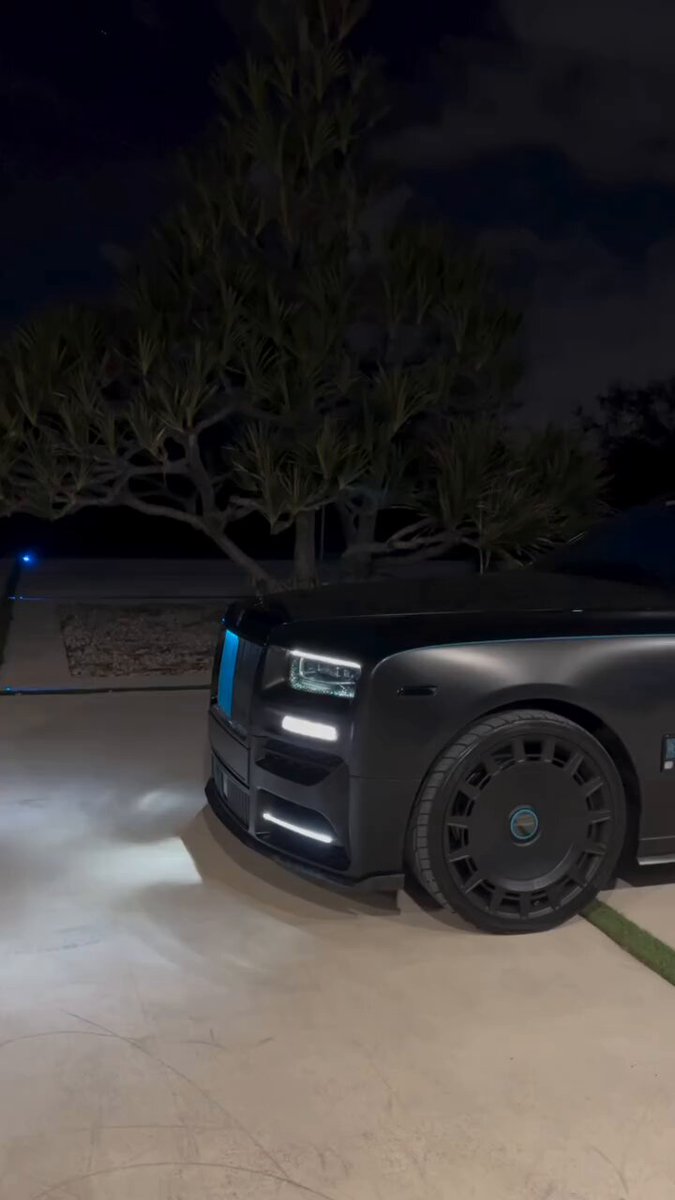 The focus of the image is a car with blue lights on its front bumper that are turned off. The car appears to be parked outdoors, possibly at night or during the evening hours. There seems to be some sort of text overlay above the image that reads "Plan remains the same Building an empire & when $DOG reaches $1, there will be the signs". This suggests a connection between the car and the concept it represents in the post. The car's blue lights could symbolize the illumination or attention required to maintain a successful business, while the phrase "Building an empire & when $DOG reaches $1" might imply a financial milestone or an indication of the vehicle's value at that particular time. However, without more context from the image itself or other elements in the scene, it is difficult to determine the exact meaning behind these visual clues.