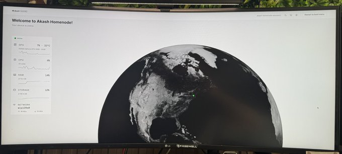 A wide LG monitor displays the Akash Homelode dashboard, showing a stylized Earth view with system metrics including 7% CPU usage, 9% GPU usage, 14% RAM, and 32% storage utilization, along with the greeting 'Welcome to Akash Homelode.'