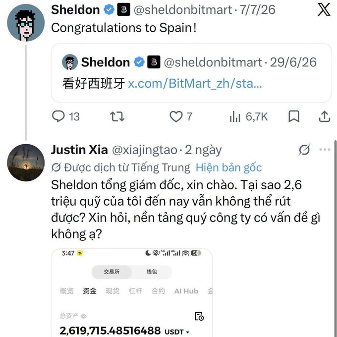 A screenshot of X (formerly Twitter) showing Sheldon (@sheldonbitmart) congratulating Spain, with a quoted tweet in Chinese supporting Spain, followed by a Vietnamese reply from Justin Xia (@xiajingtao) complaining about being unable to withdraw 2.6 million USDT from BitMart.