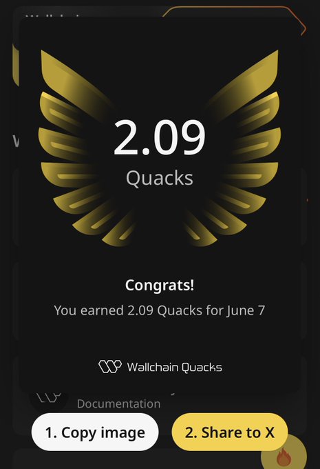 The image shows a black phone screen displaying a message congratulating the user for earning 2,09Quacks for June 7. The user has earned this reward, which they have received via an app called Quacks.