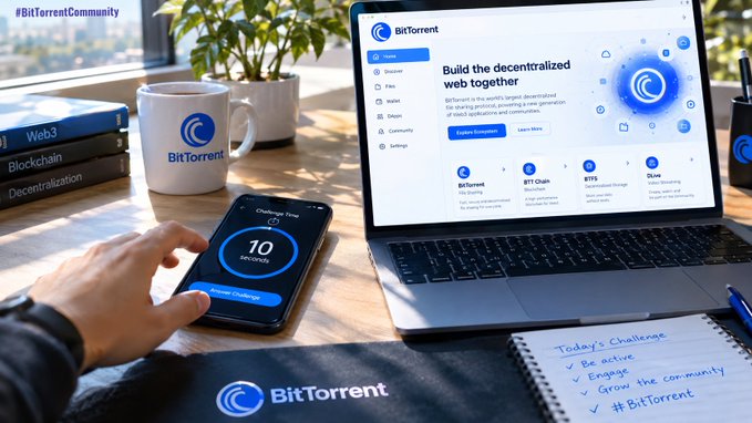 A hand interacts with a phone showing a "10 Seconds Challenge" app alongside a laptop displaying the BitTorrent website ("Build the decentralized web together"), accompanied by BitTorrent-branded mugs, books labeled "Web3," "Blockchain," and "Decentralization," and a notebook listing today's challenge items ("Be active," "Engage," "Grow the community," "#BitTorrent"), visually reinforcing the post's call for community members to quickly name three BitTorrent ecosystem products in 10 seconds.