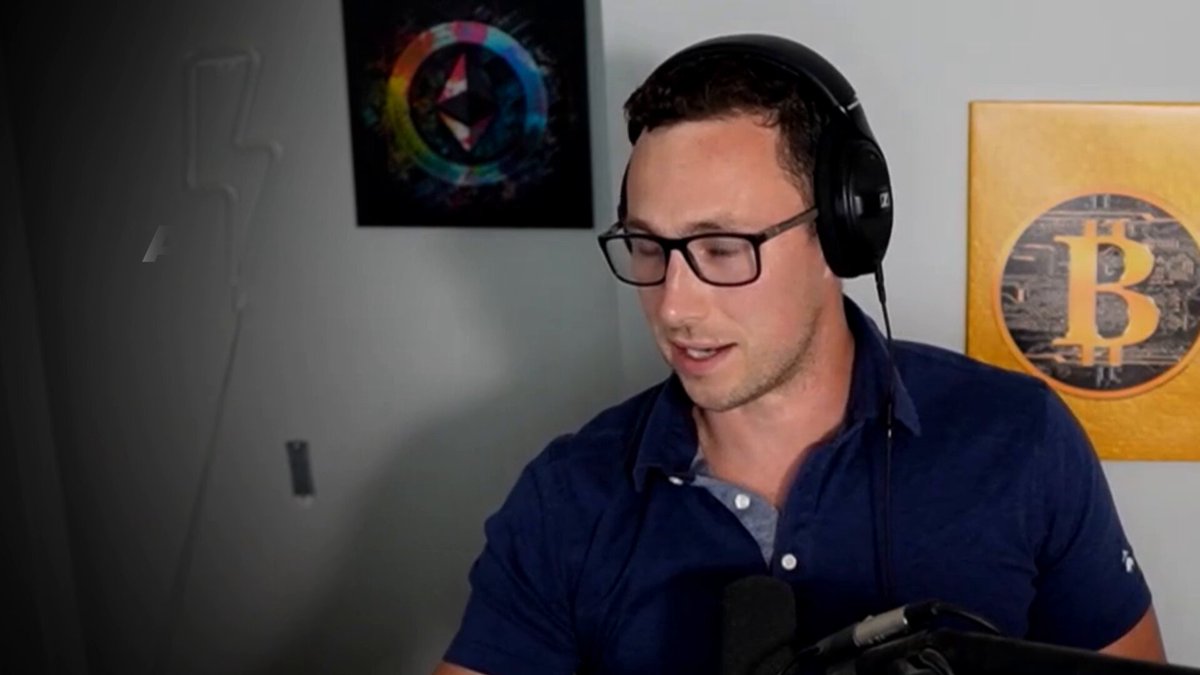A man wearing headphones, glasses, and a navy polo shirt speaks into a microphone during a podcast recording. Behind him hangs a colorful Ethereum logo artwork and a golden Bitcoin emblem, fitting the crypto/DeFi theme of the "Fully Vested Pod by DefiLlama" episode discussing Velodrome and Aerodrome.