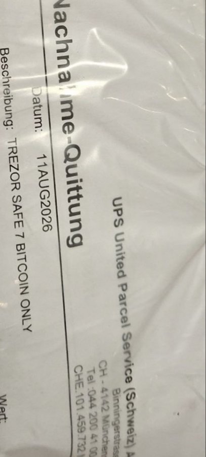 A close-up of a UPS shipping label written in German addressed to 'TREZOR SAFE 7 BITCOIN ONLY' with a Swiss delivery address dated 11 AUG 2026.