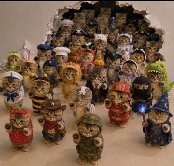 A collection of small cat figurines dressed in various costumes, including a bee, firefighter, sailor, wizard, and military outfits, displayed in front of a rock-like cave backdrop.
