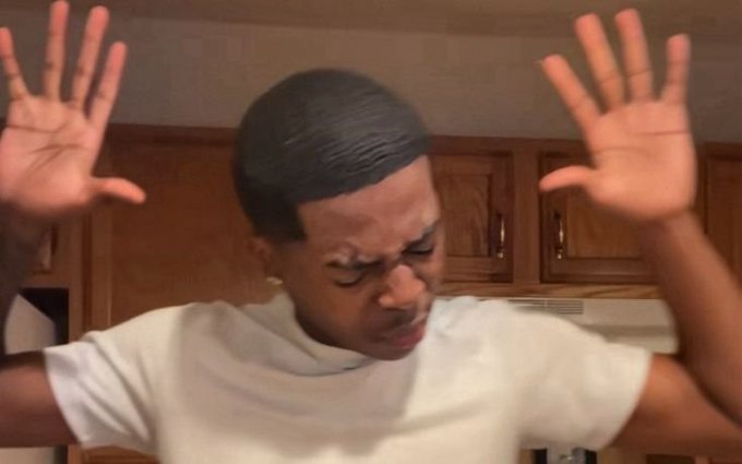A person raises both hands in an exaggerated facepalm/wince expression, embodying the regret of treating unclaimed airdrops as guaranteed net worth before eventually realizing the value never materialized. The pose visually captures the "downbad" hindsight moment of crypto over-optimism turned disappointment.