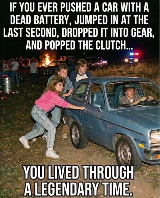 A vintage-style meme with text 'IF YOU EVER PUSHED A CAR WITH A DEAD BATTERY, JUMPED IN AT THE LAST SECOND, DROPPED IT INTO GEAR, AND POPPED THE CLUTCH... YOU LIVED THROUGH A LEGENDARY TIME' over an image of people pushing a blue car at night.