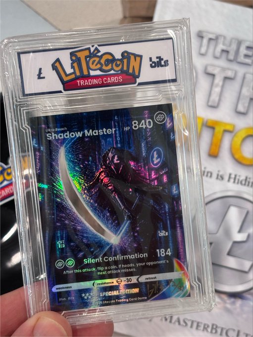 A hand holds a holographic Litecoin Trading Card featuring "Shadow Master" with HP 840 and the attack "Silent Confirmation 184," shown in protective case with a Litecoin Trading Cards branded topper, alongside a copy of "The Other Bitcoin" book signed by @MASTERBTCLTC in the background.