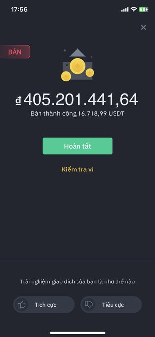 A Vietnamese mobile app screen in dark mode showing a successful sale ('BÁN') transaction of '₫405.201.441,64' (approximately 16,718.99 USDT) with 'Hoàn tất' (Complete) and 'Kiểm tra ví' (Check wallet) buttons, plus feedback prompts at the bottom.