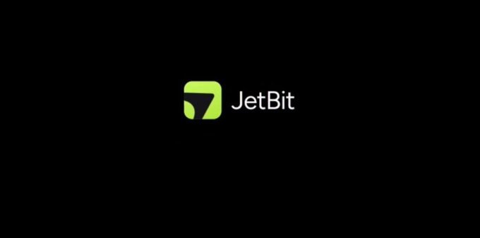 A logo screen on a black background featuring a green and black "J" icon next to the text "JetBit."