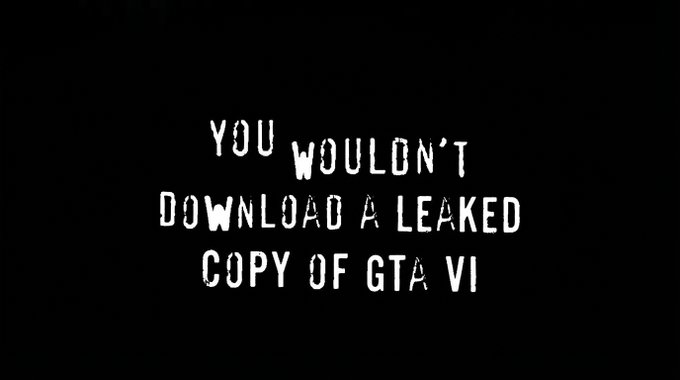 A black screen displaying the white text 'YOU WOULDN'T DOWNLOAD A LEAKED COPY OF GTA VI' in a stylized, distressed font, parodying the famous anti-piracy PSA from the early 2000s.