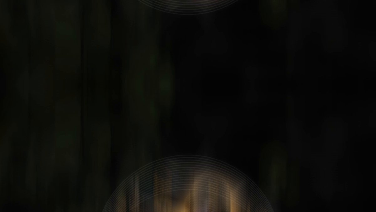 Focus on the white letters that say "L uncensified" at the top of the image. The main focus should be a black background with yellow lines radiating from the center, creating an interesting visual effect against the dark gray or brown backdrop.